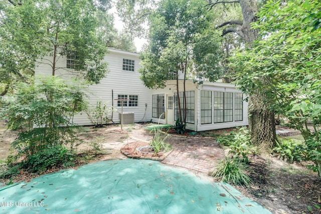 2512 Randall Dr, Biloxi, MS 39531 - rear view of house with a sunroom and a patio area