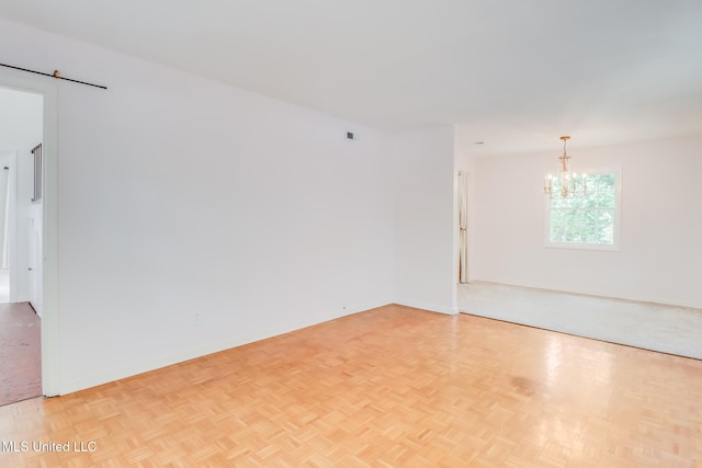 2512 Randall Dr, Biloxi, MS 39531 - empty room featuring a chandelier and baseboards