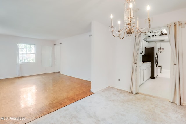 2512 Randall Dr, Biloxi, MS 39531 - spare room with a chandelier and baseboards