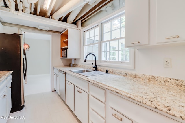 2512 Randall Dr, Biloxi, MS 39531 - kitchen with appliances with stainless steel finishes, white cabinets, and healthy amount of natural light