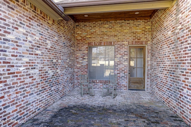 doorway to property with a patio