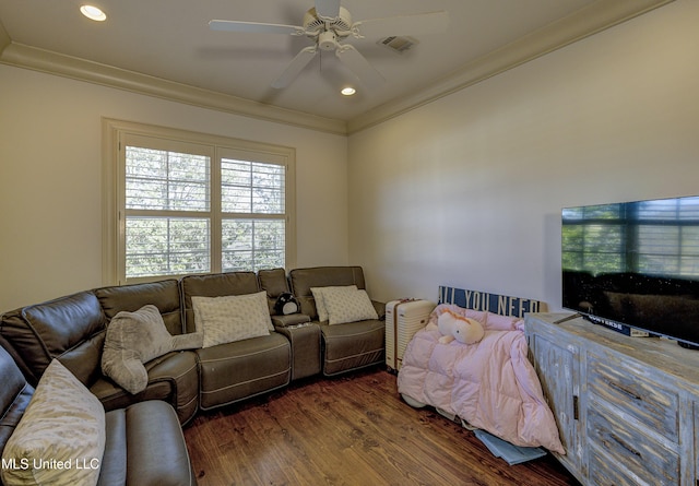 living room featuring ceiling fan, ornamental molding, and dark hardwood / wood-style flooring