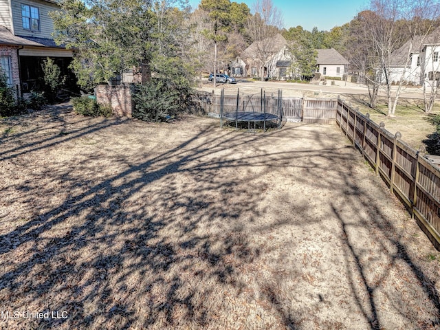 view of yard featuring a trampoline