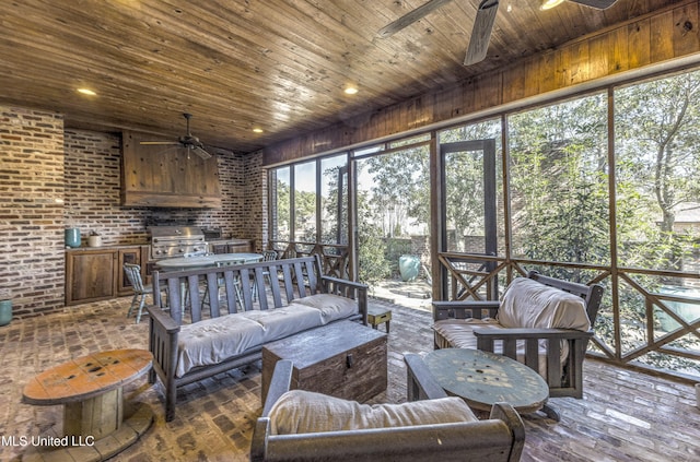 sunroom / solarium with ceiling fan and wooden ceiling