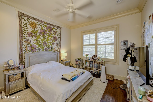 bedroom with ceiling fan, ornamental molding, and dark hardwood / wood-style flooring