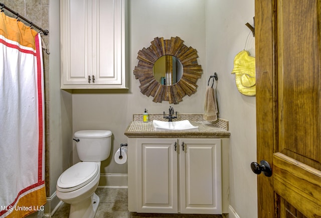 bathroom featuring vanity, a shower with curtain, and toilet