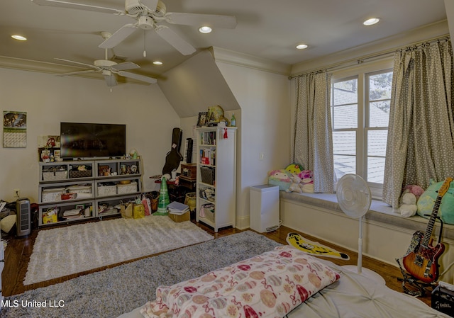 bedroom with crown molding, wood-type flooring, ceiling fan, and vaulted ceiling