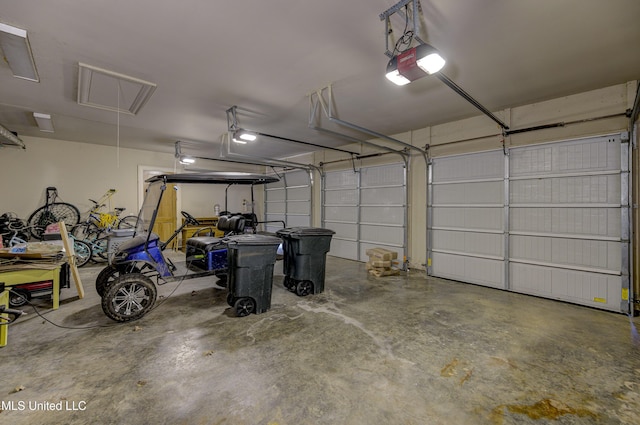 garage featuring a garage door opener