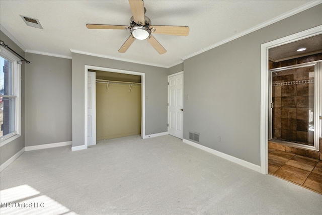 unfurnished bedroom featuring a closet, ceiling fan, ornamental molding, and light colored carpet