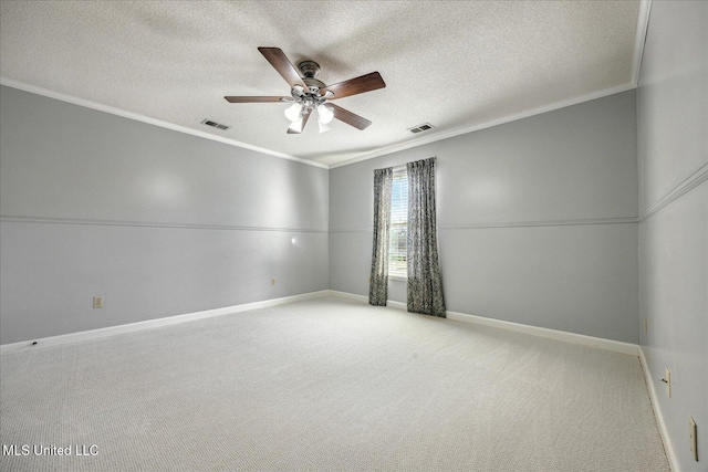 unfurnished room with ceiling fan, light colored carpet, a textured ceiling, and ornamental molding