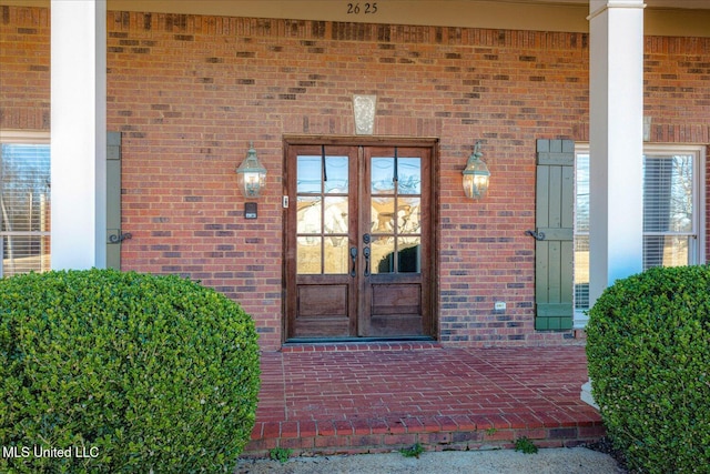 view of exterior entry featuring french doors