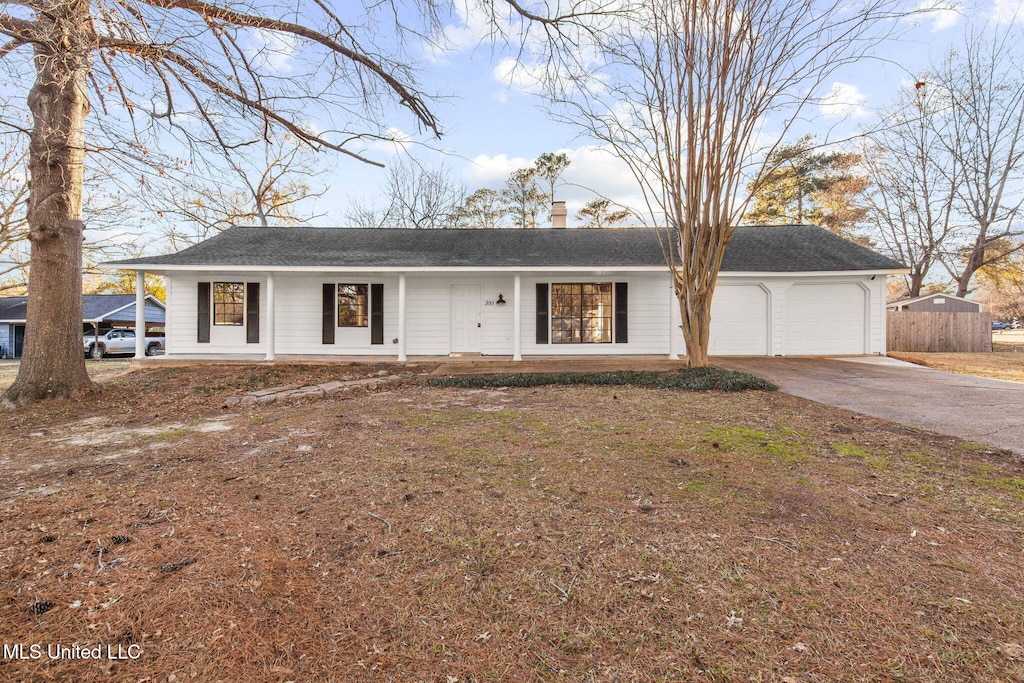 ranch-style home featuring a garage and a porch