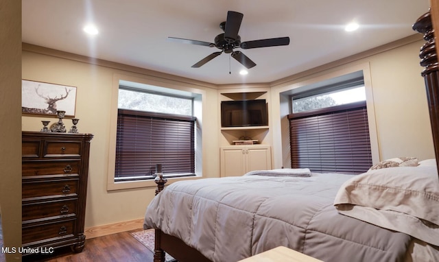 bedroom featuring ceiling fan and dark hardwood / wood-style floors