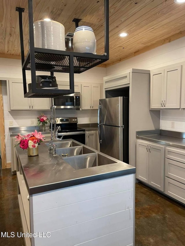 kitchen featuring white cabinetry, stainless steel appliances, wooden ceiling, and a center island with sink