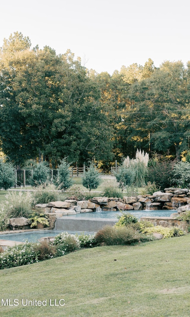 view of community with a lawn