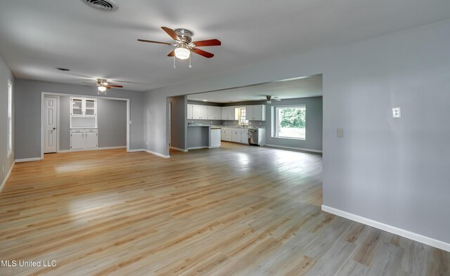 5887 Scotland Rd, Bentonia, MS 39040 - unfurnished living room with a ceiling fan, baseboards, and light wood-style floors