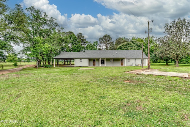 5887 Scotland Rd, Bentonia, MS 39040 - view of front of home with a front lawn, view of wooded area, and a carport