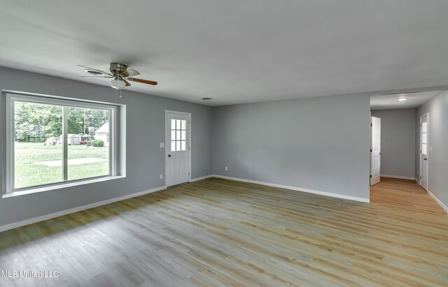 5887 Scotland Rd, Bentonia, MS 39040 - unfurnished living room with ceiling fan, baseboards, and wood finished floors