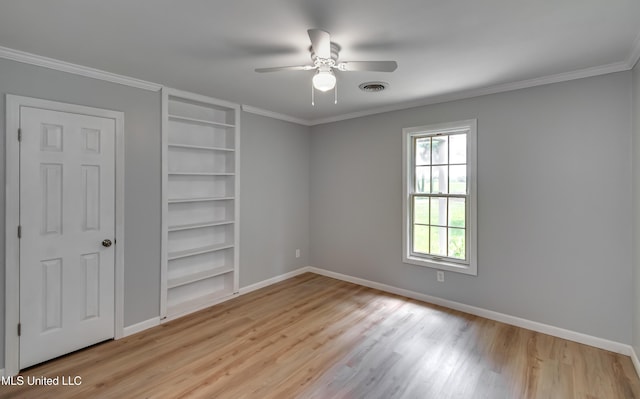 5887 Scotland Rd, Bentonia, MS 39040 - unfurnished bedroom with wood finished floors, baseboards, crown molding, and ceiling fan