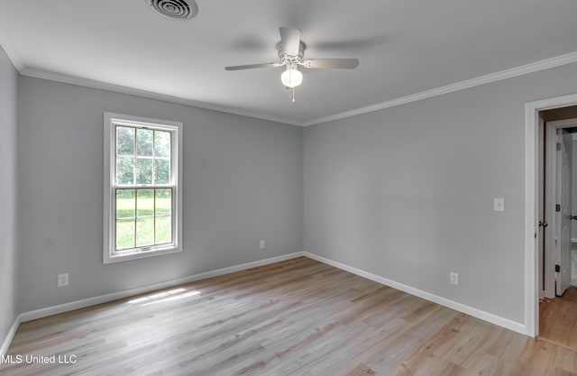 5887 Scotland Rd, Bentonia, MS 39040 - spare room featuring crown molding, light wood-type flooring, ceiling fan, and baseboards