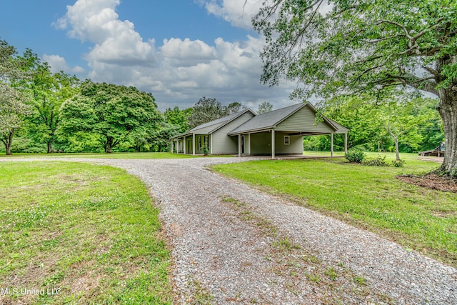 5887 Scotland Rd, Bentonia, MS 39040 - view of front of house with driveway, a front yard, and an attached carport