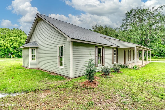 5887 Scotland Rd, Bentonia, MS 39040 - view of home's exterior featuring a shingled roof and a yard