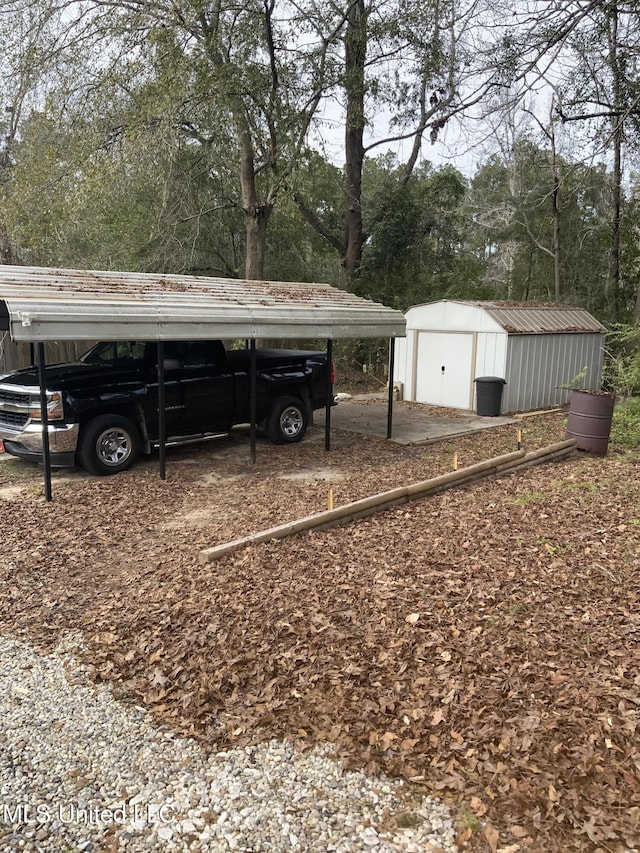 view of yard with a carport and a shed