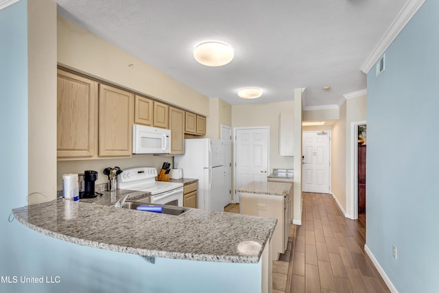 kitchen with light stone countertops, light brown cabinets, kitchen peninsula, crown molding, and white appliances