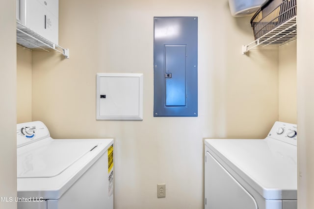 clothes washing area featuring washer and dryer and electric panel