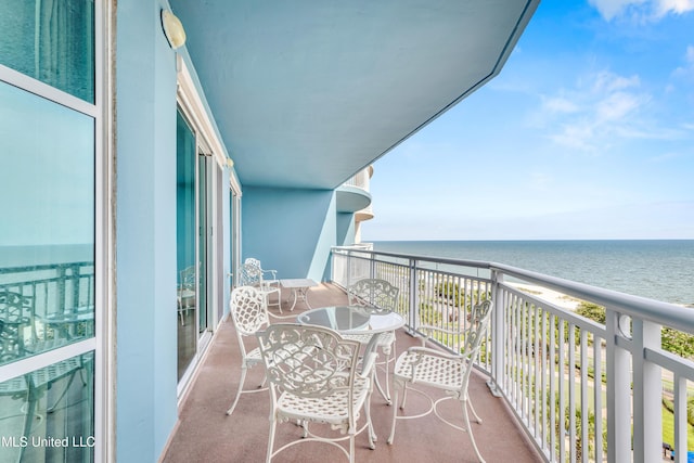 balcony featuring a water view