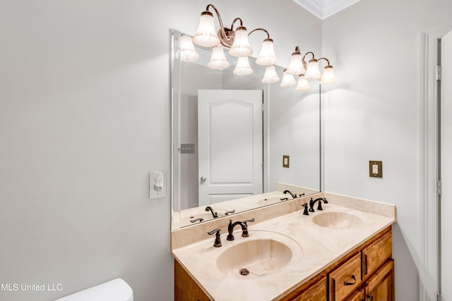 7528 Crooked Stick Dr, Diamondhead, MS 39525 - bathroom with double vanity, a chandelier, and ornamental molding
