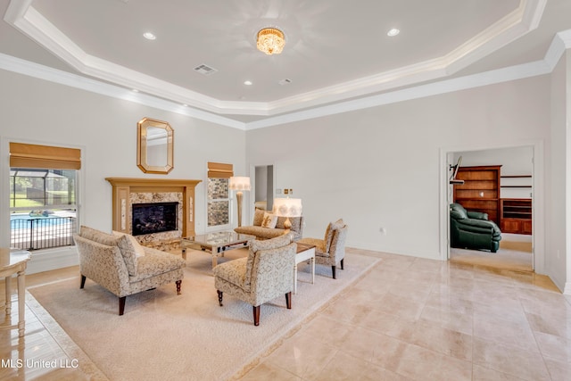 7528 Crooked Stick Dr, Diamondhead, MS 39525 - living room with a tray ceiling, crown molding, a premium fireplace, a high ceiling, and recessed lighting
