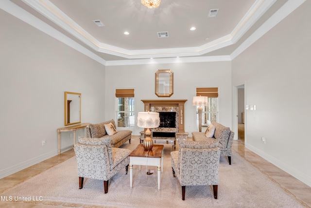 7528 Crooked Stick Dr, Diamondhead, MS 39525 - living room with a raised ceiling, ornamental molding, a premium fireplace, a towering ceiling, and light tile patterned floors