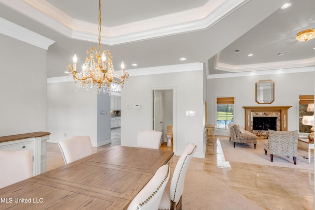 7528 Crooked Stick Dr, Diamondhead, MS 39525 - dining area with a raised ceiling, crown molding, a chandelier, recessed lighting, and a premium fireplace