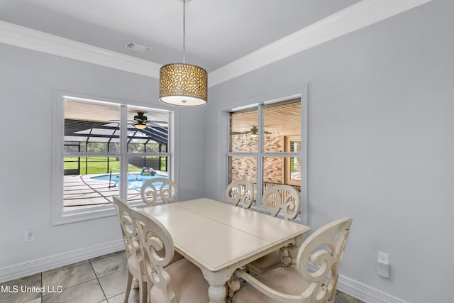 7528 Crooked Stick Dr, Diamondhead, MS 39525 - dining area featuring ornamental molding, healthy amount of natural light, and light tile patterned flooring
