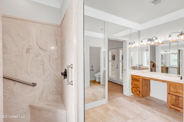 7528 Crooked Stick Dr, Diamondhead, MS 39525 - bathroom featuring crown molding, vanity, and a chandelier