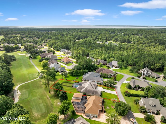 7528 Crooked Stick Dr, Diamondhead, MS 39525 - aerial perspective of suburban area featuring a forest and property parcel outlined
