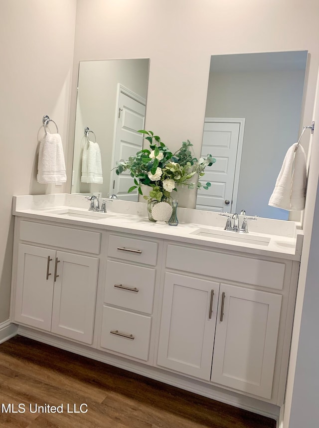 bathroom featuring vanity and hardwood / wood-style floors