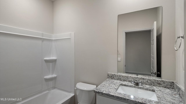 full bathroom with vanity, shower / tub combination, and toilet