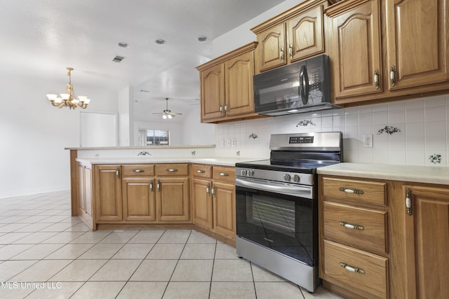 kitchen with backsplash, kitchen peninsula, light tile patterned floors, and electric range