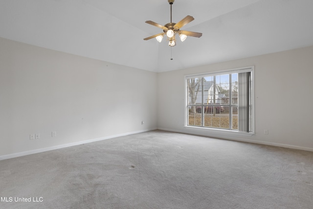 spare room with lofted ceiling, light carpet, and ceiling fan