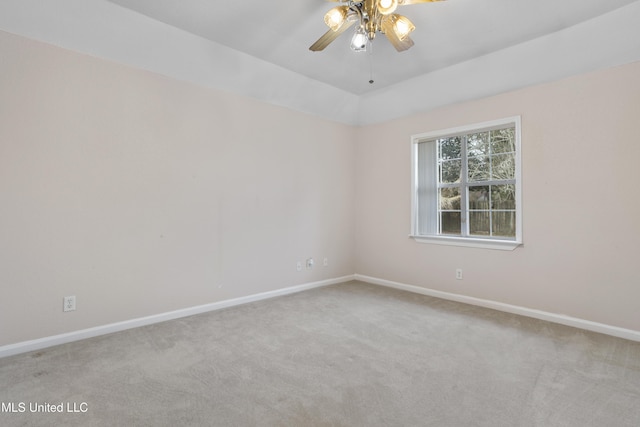 carpeted empty room with vaulted ceiling and ceiling fan