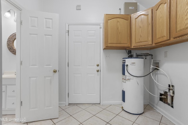 laundry room with light tile patterned flooring, cabinets, hookup for a washing machine, and electric water heater