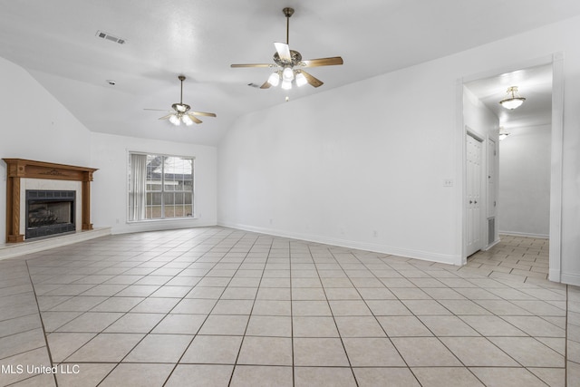 unfurnished living room with vaulted ceiling, light tile patterned floors, and ceiling fan