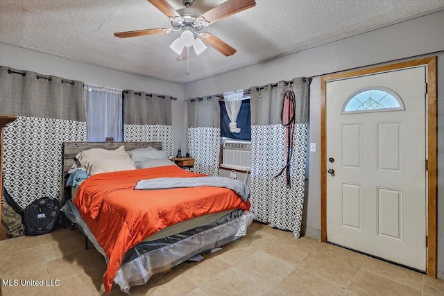 560 Bailey St, Mendenhall, MS 39114 - bedroom with a textured ceiling, a ceiling fan, and cooling unit