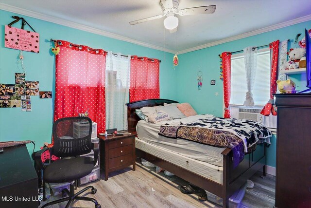 560 Bailey St, Mendenhall, MS 39114 - bedroom with wood finished floors, crown molding, cooling unit, a ceiling fan, and a desk