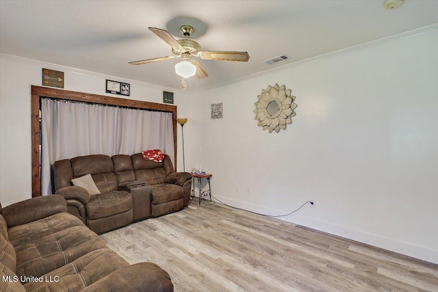 560 Bailey St, Mendenhall, MS 39114 - living area with light wood-type flooring, a ceiling fan, ornamental molding, and baseboards