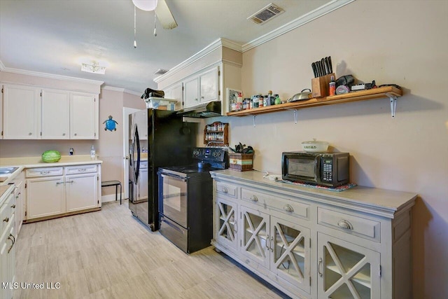 560 Bailey St, Mendenhall, MS 39114 - kitchen featuring black appliances, ornamental molding, light countertops, and white cabinetry