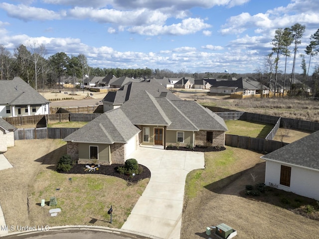 birds eye view of property with a residential view