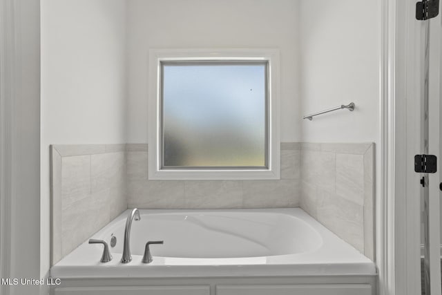 bathroom featuring a garden tub